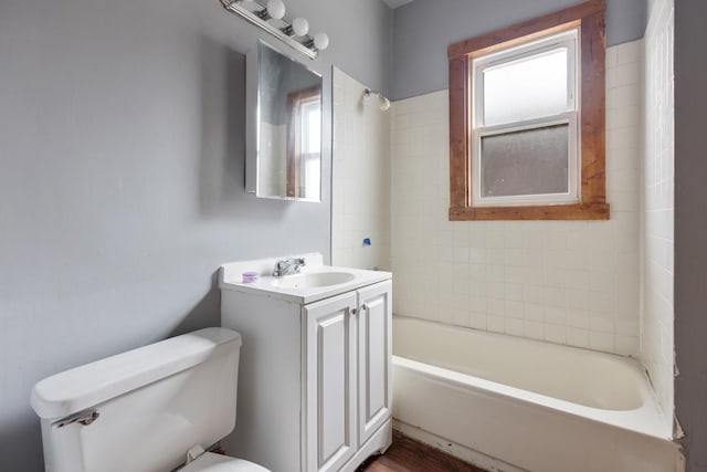 7521 S Parnell Ave, Chicago, IL 60620 - bathroom featuring tub / shower combination, a wealth of natural light, toilet, and vanity