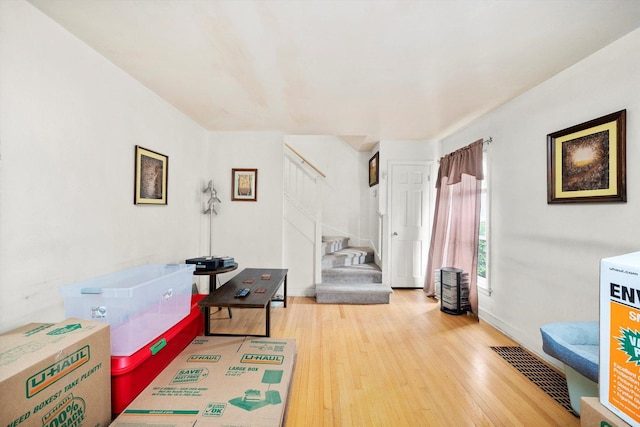 429 Geneva Ave, Bellwood, IL 60104 - rec room with light wood-type flooring, baseboards, and visible vents