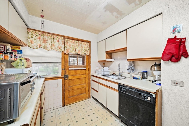 429 Geneva Ave, Bellwood, IL 60104 - kitchen featuring light countertops, a sink, stainless steel microwave, white cabinetry, and dishwasher
