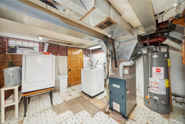 429 Geneva Ave, Bellwood, IL 60104 - unfinished below grade area featuring washing machine and dryer, water heater, tile patterned floors, and visible vents