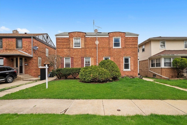 429 Geneva Ave, Bellwood, IL 60104 - view of front facade featuring a front lawn and brick siding
