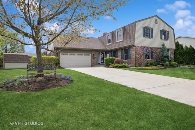 dutch colonial featuring a shingled roof, an attached garage, a gambrel roof, brick siding, and a front yard