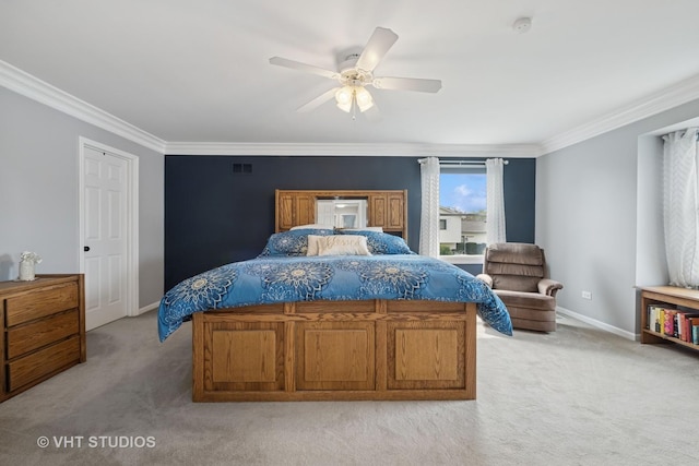 bedroom featuring a ceiling fan, visible vents, crown molding, baseboards, and light carpet