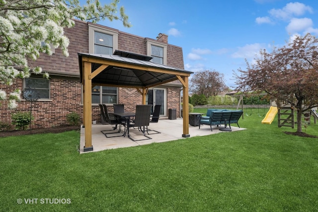 back of property with a lawn, a gazebo, mansard roof, and brick siding
