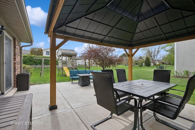 view of patio with a gazebo, outdoor dining area, and a playground