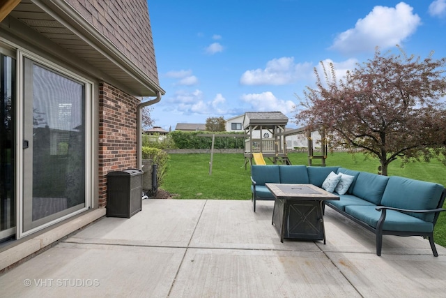 view of patio with an outdoor living space and a playground