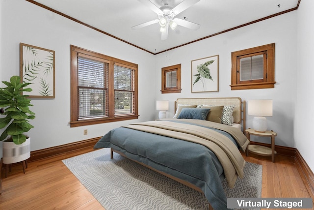 bedroom featuring crown molding, baseboards, and light wood-type flooring