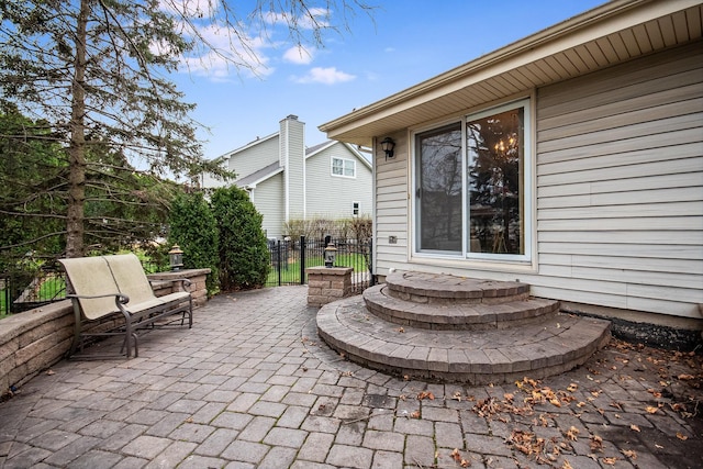 view of patio / terrace featuring fence