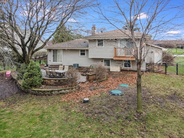 back of house with central AC, a chimney, a deck, fence, and a patio