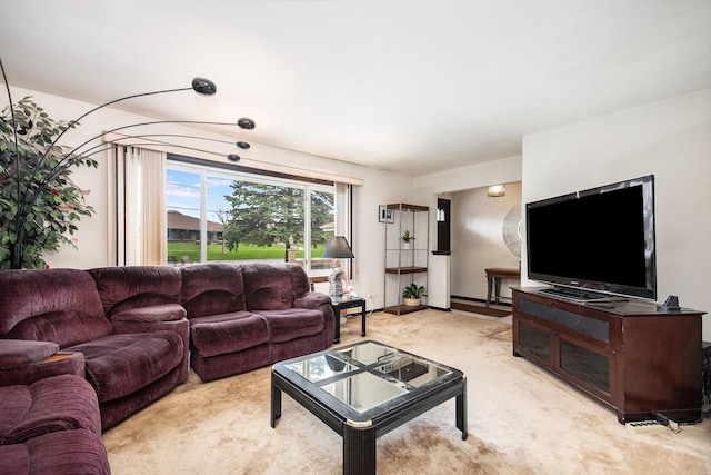 living area with light carpet