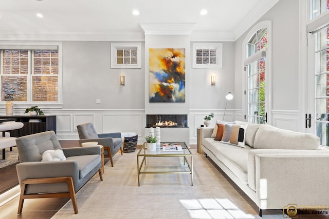 816 W Lill Ave, Chicago, IL 60614 - living room with a decorative wall, a warm lit fireplace, wainscoting, ornamental molding, and recessed lighting