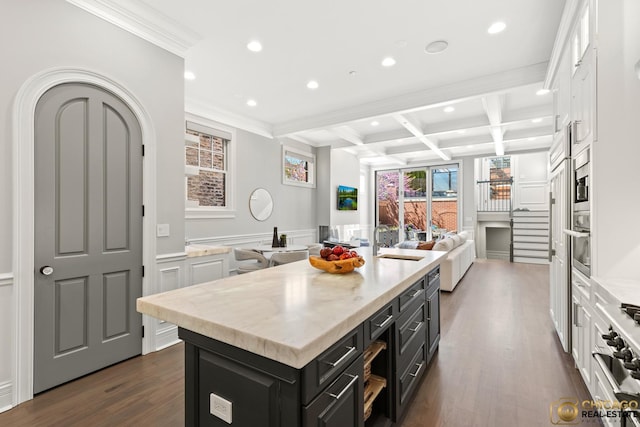 816 W Lill Ave, Chicago, IL 60614 - kitchen featuring coffered ceiling, recessed lighting, a decorative wall, open floor plan, and beamed ceiling