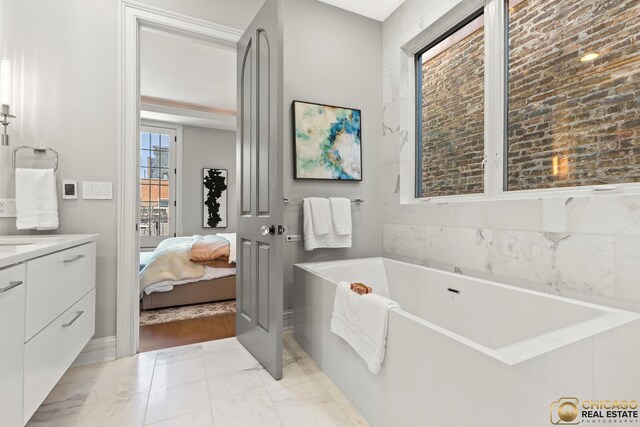 816 W Lill Ave, Chicago, IL 60614 - ensuite bathroom with marble finish flooring, vanity, and a freestanding bath