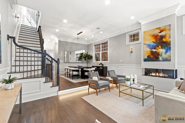 816 W Lill Ave, Chicago, IL 60614 - living room featuring a decorative wall, recessed lighting, ornamental molding, stairs, and a glass covered fireplace