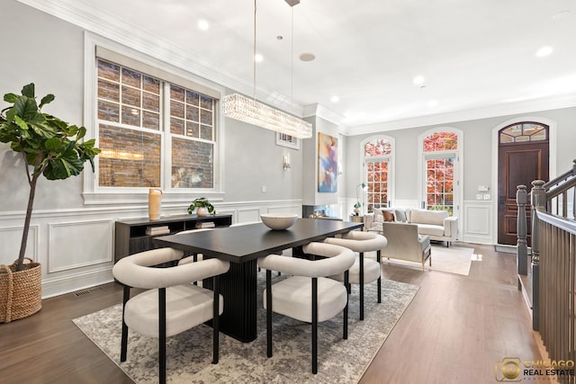 816 W Lill Ave, Chicago, IL 60614 - dining area with a decorative wall, a wainscoted wall, recessed lighting, dark wood-type flooring, and crown molding