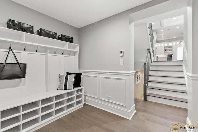 816 W Lill Ave, Chicago, IL 60614 - mudroom with wood finished floors, wainscoting, recessed lighting, and a decorative wall