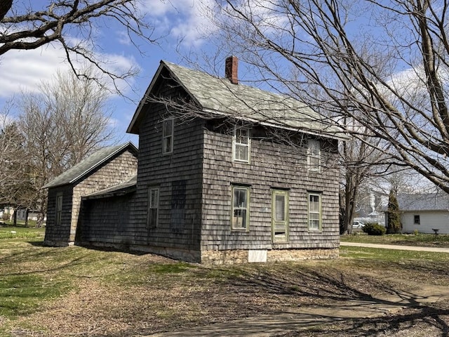view of side of property with a chimney