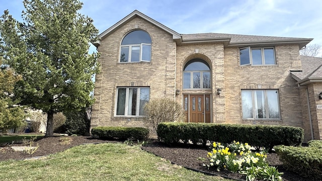 10901 Fawn Trail Dr, Orland Park, IL 60467 - traditional home with a front lawn, brick siding, and a shingled roof