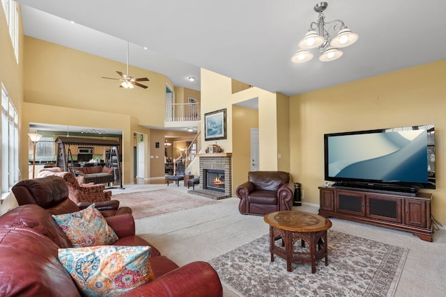 1289 Mallard Ln, Hoffman Estates, IL 60192 - living room with a fireplace, carpet flooring, baseboards, and ceiling fan with notable chandelier