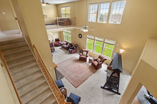 1289 Mallard Ln, Hoffman Estates, IL 60192 - carpeted living area with baseboards, a towering ceiling, and ceiling fan