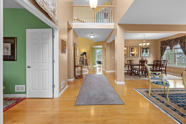 1289 Mallard Ln, Hoffman Estates, IL 60192 - foyer with baseboards, a chandelier, wood finished floors, and visible vents