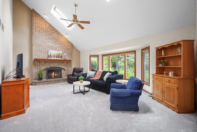 2756 Fox River Ln, Naperville, IL 60565 - living room with light colored carpet, high vaulted ceiling, a fireplace, ceiling fan, and a skylight