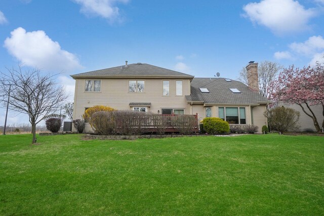 2756 Fox River Ln, Naperville, IL 60565 - rear view of house featuring a chimney, a yard, and a deck