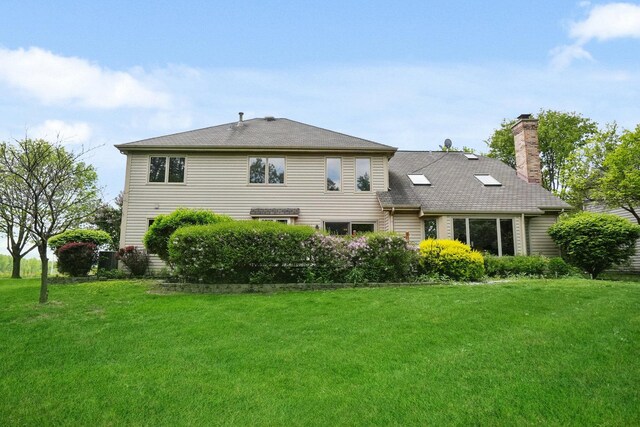 2756 Fox River Ln, Naperville, IL 60565 - rear view of house featuring a chimney and a lawn