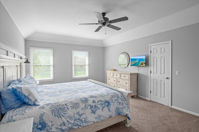 carpeted bedroom with baseboards, a ceiling fan, and lofted ceiling