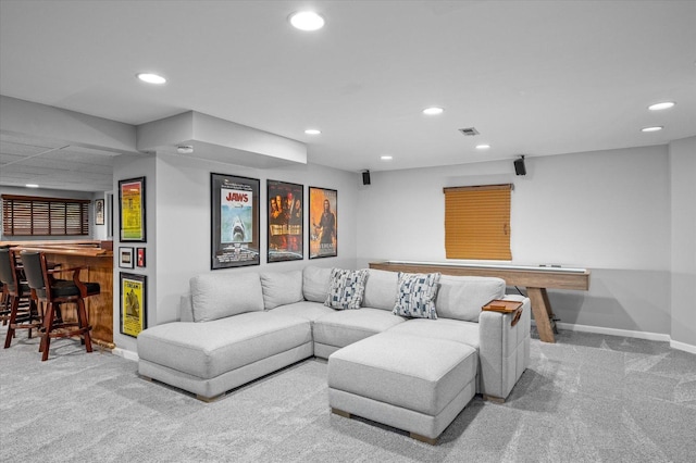 living room featuring recessed lighting, baseboards, and carpet
