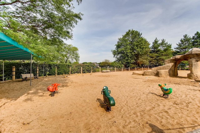 view of home's community featuring fence