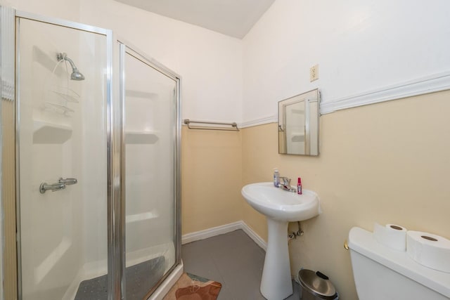 7748 S Saginaw Ave, Chicago, IL 60649 - bathroom featuring toilet, tile patterned floors, a stall shower, and a sink
