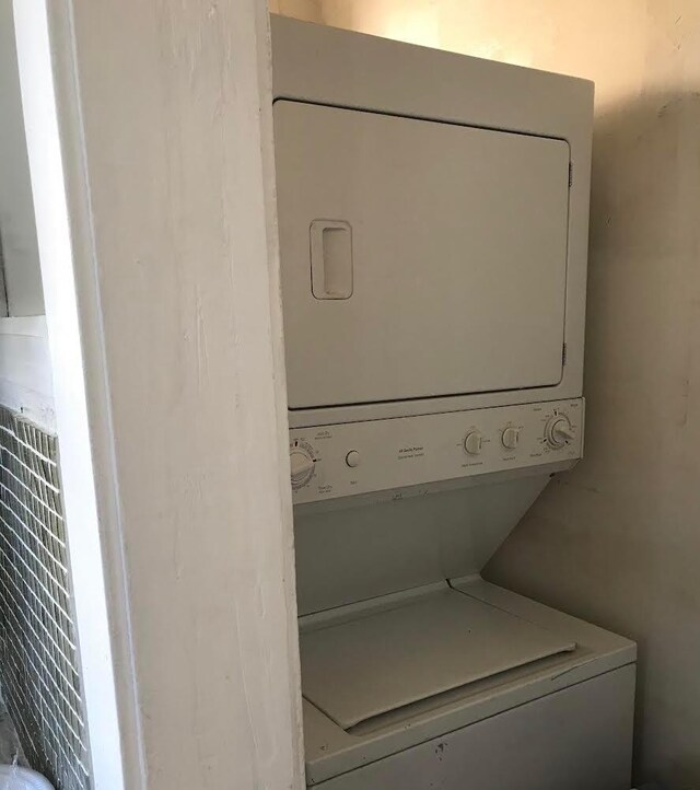 7748 S Saginaw Ave, Chicago, IL 60649 - laundry area featuring stacked washer / drying machine
