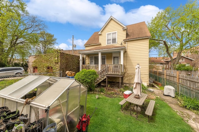 7748 S Saginaw Ave, Chicago, IL 60649 - back of property featuring an exterior structure, an outdoor structure, stairs, and roof with shingles