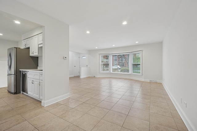 unfurnished living room featuring baseboards, recessed lighting, and light tile patterned floors