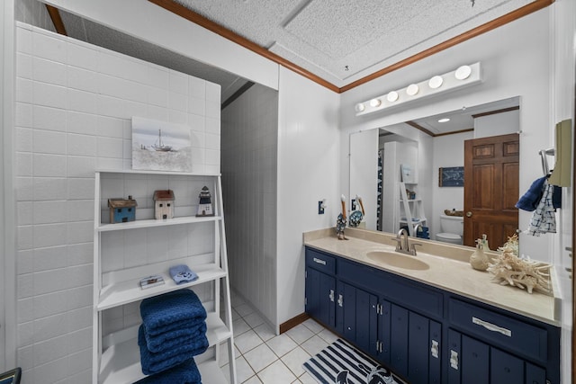bathroom with a textured ceiling, toilet, tile patterned flooring, vanity, and ornamental molding