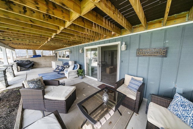 deck with outdoor lounge area and a patio