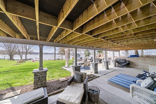 view of patio featuring a water view
