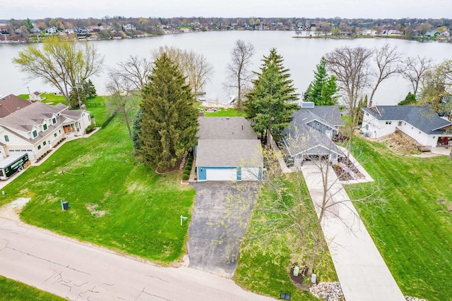 bird's eye view with a residential view and a water view