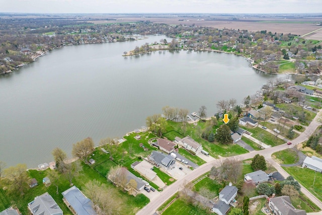 drone / aerial view with a water view and a residential view