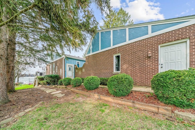 view of front of house featuring brick siding