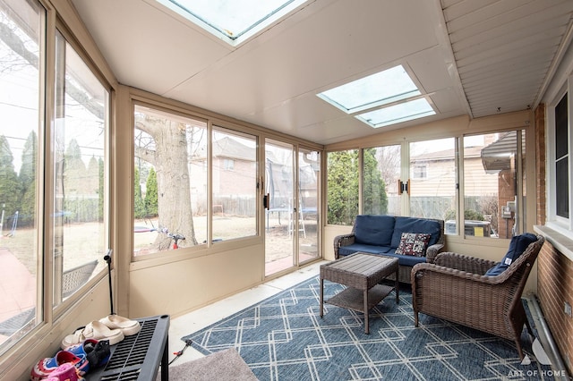 sunroom with an outdoor living space and a skylight