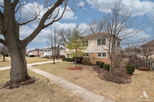 view of front facade featuring a front lawn and a residential view