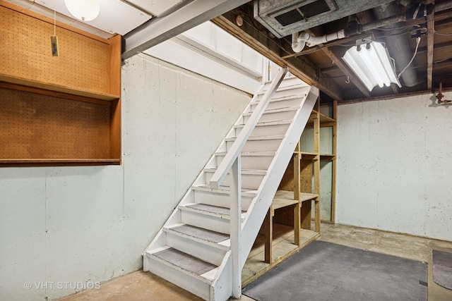 unfinished below grade area with stairway and visible vents