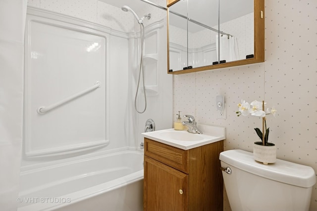 bathroom featuring shower / tub combo, wallpapered walls, vanity, and toilet