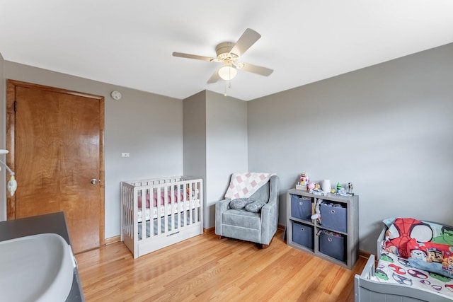 5626 S Nashville Ave, Chicago, IL 60638 - bedroom featuring wood finished floors, a sink, and a ceiling fan