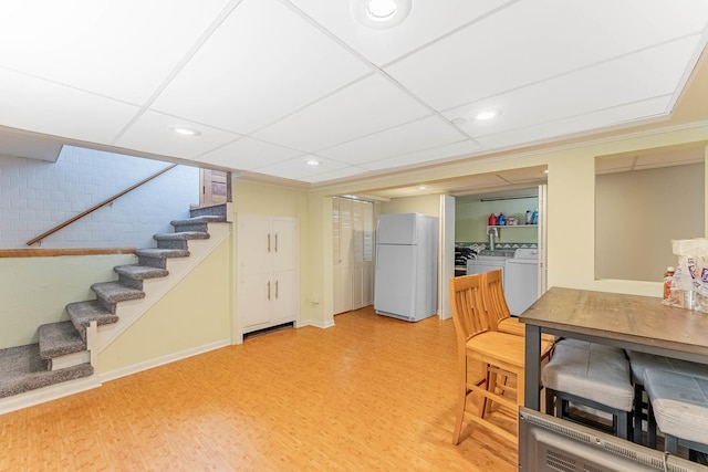 5626 S Nashville Ave, Chicago, IL 60638 - interior space with washing machine and dryer, stairs, light wood-style flooring, and recessed lighting