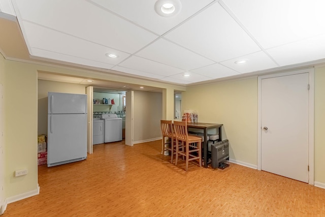 5626 S Nashville Ave, Chicago, IL 60638 - dining room with washer and dryer, light wood-style floors, and baseboards