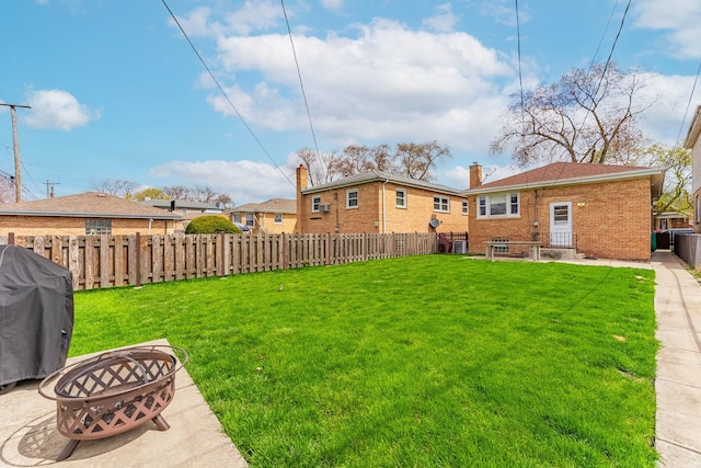 5626 S Nashville Ave, Chicago, IL 60638 - view of yard with a patio area, a fenced backyard, and a fire pit
