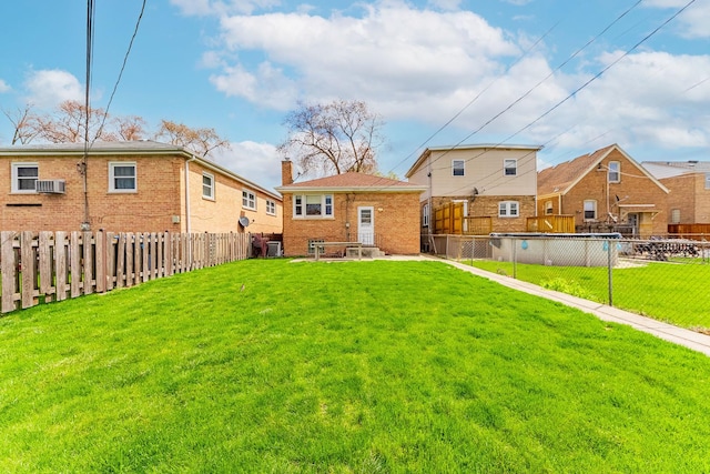 5626 S Nashville Ave, Chicago, IL 60638 - rear view of house featuring a fenced backyard, a lawn, and a chimney